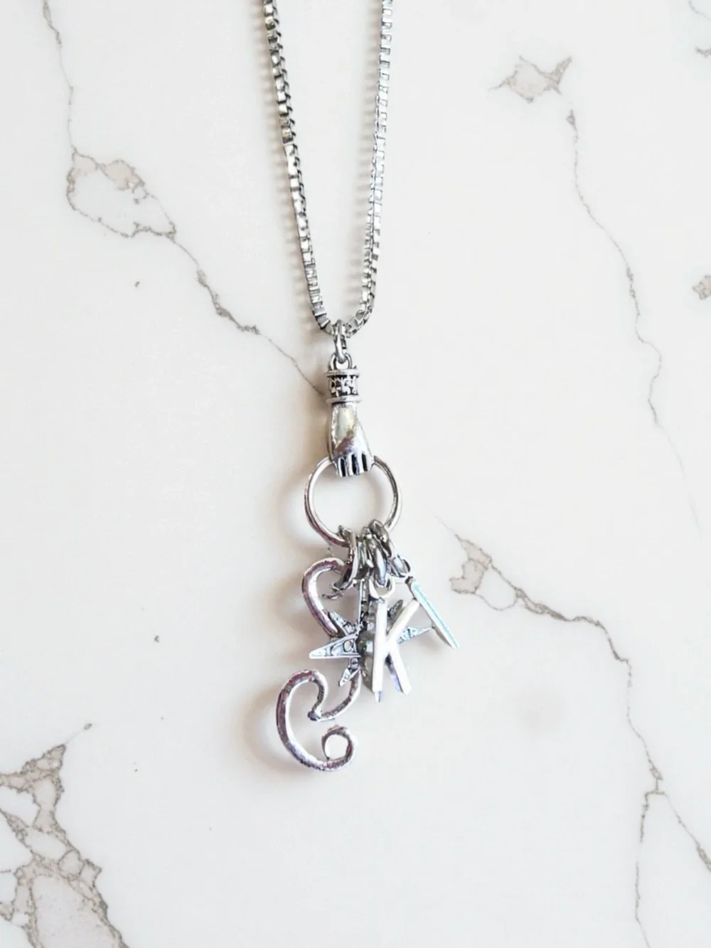 Monk DND necklace with the wind, a star, and KI Dungeons and Dragons jewelry